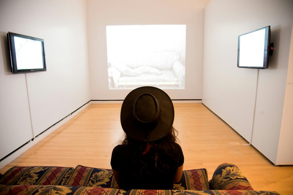 Image of a woman experiencing AI in a museum 