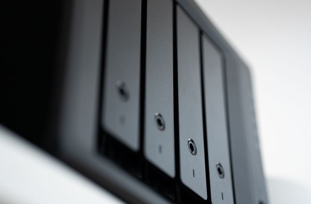 A black Network attached storage box with hard drives