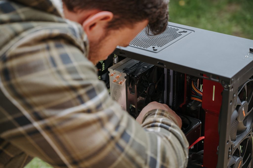 A man upgrading the ram on his PC